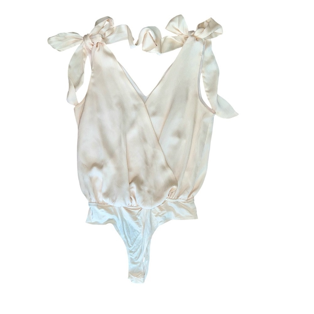 Lt peach/cream bodysuit size small